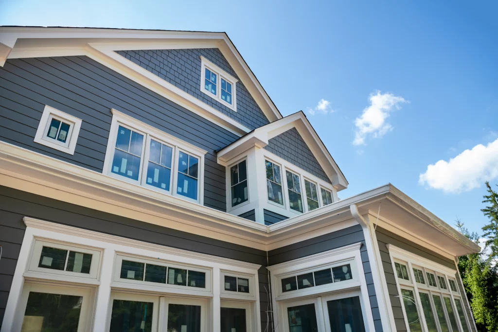 Modern grey house with white trim and windows.